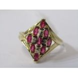 14ct RUBY & DIAMOND RING, 9 well matched oval cut rubies, seperated by accent brilliant cut diamonds