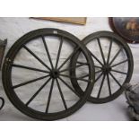 TRANSPORT ANTIQUES, a pair of dark green painted carriage wheels, 34" diameter