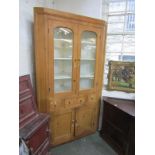PINE CORNER CUPBOARD, Georgian stripped pine glaze corner cupboard with twin doors above, fitted 3