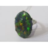 OPAL RING, large cabochon cut black opal in 6 claw setting on white gold mount, tests high carat,