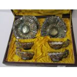 ORIENTAL CERAMICS, cased set of 4 Japanese tea bowls in silver mounts and ornate floral embossed