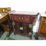 ORIENTAL FURNITURE, an Eastern carved twin cupboard base cabinet with single frieze drawer,