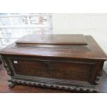 ANTIQUE OAK CASSONE CASKET, carved claw feet and fluted rim with applied spindle sides, 34" width