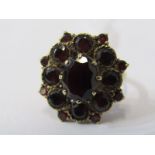 9CT YELLOW GOLD GARNET CLUSTER RING, principal oval garnet surrounded by graduated size garnets in