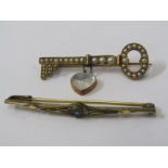 TWO YELLOW METAL BROOCHES, one in the form of a key, set seed pearl & moonstone