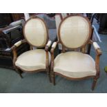 PAIR OF FRENCH WALNUT FAUTEIL ARMCHAIRS, foliate carved cresting and arm supports above tapering