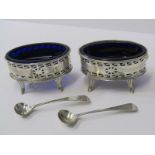 IRISH SILVER SALTS, of oval form with pierced borders and blue glass liners on 4 cusp feet, marks