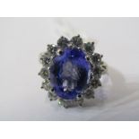 18ct WHITE GOLD TANZANITE & DIAMOND CLUSTER RING, principal oval cut tanzanite in excess of 3 cts