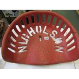 AGRICULTURAL ANTIQUES, a red painted cast iron implement seat "Nicholson", 17" width