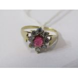 9ct YELLOW GOLD RUBY CLUSTER RING, principal pale red ruby surrounded by CZ stones in 9ct yellow