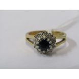 9CT YELLOW GOLD SAPPHIRE & DIAMOND CLUSTER RING, principal round brilliant cut sapphire set in a