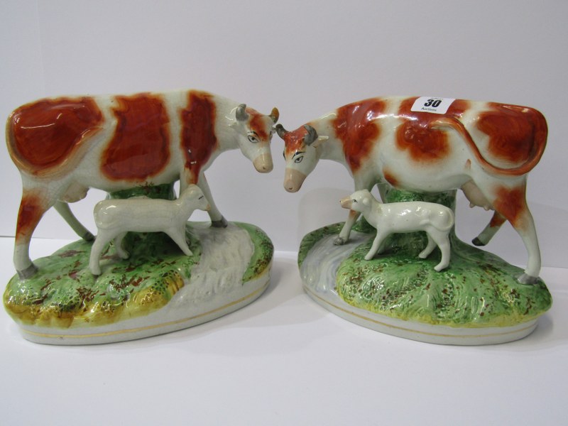 STAFFORDSHIRE POTTERY, pair of 19th Century Heifer and Calf riverside figure groups (some