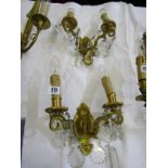 LIGHTING, pair of antique brass design twin brass wall lights with cut glass droplets, 9" height