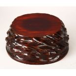 A GOOD HEAVY QUALITY 19TH CENTURY CHINESE HARDWOOD CARVED STAND, the stand carved in a natural