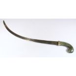 AN 18TH/19TH CENTURY INDIAN SWORD WITH CARVED HARDSTONE HILT, and fullered curving single-edged