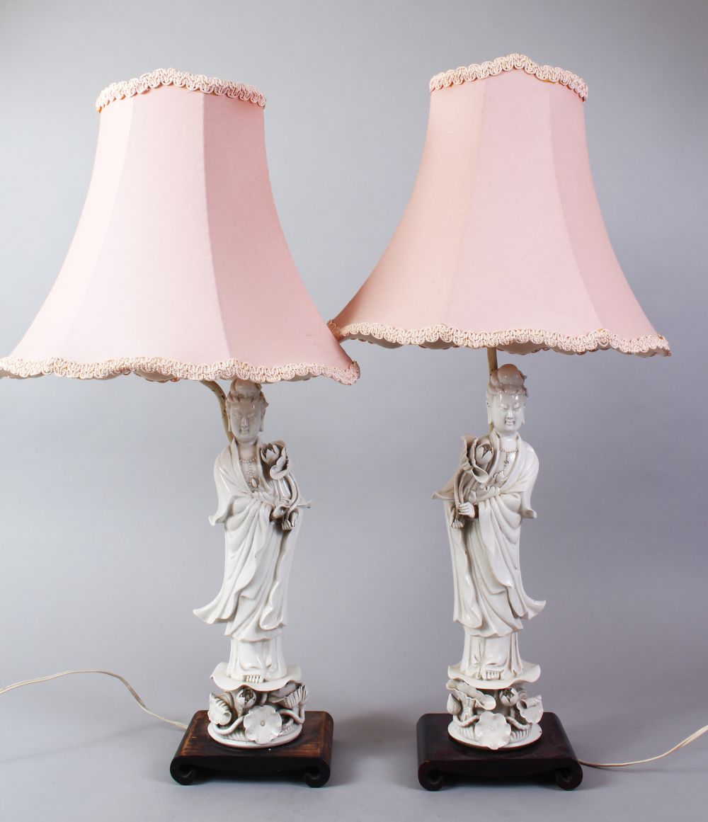 A PAIR OF 20TH CENTURY CHINESE BLANC DE CHINE KANGXI STYLE PORCELAIN FIGURAL LAMPS OF GUANYIN, The