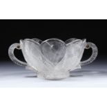 A GOOD CARVED ROCK CRYSTAL TWIN HANDLED BOWL, of lotus leaf design, 15cm wide, in fitted box.
