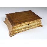 A KOFTAGARI GILT DECORATED STEEL BOX, with hinged lid on bracket feet, 21cm wide.