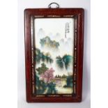 A GOOD CHINESE REPUBLIC STYLE PORCELAIN FRAMED PANEL, the panel depicting figures amongst native