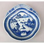 A GOOD 18TH CENTURY CHINESE BLUE & WHITE NAN KING PORCELAIN DISH, the moulded dish decorated with