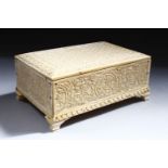 A GOOD LATE 19TH CENTURY IVORY BOX AND COVER, with foliate carved decoration, 17cm wide.