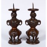 A PAIR OF 19TH CENTURY JAPANESE BRONZE ALTER PRICKET'S, with moulded elephant handles and feet, with