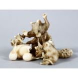 A GOOD JAPANESE MEIJI PERIOD CARVED IVORY OKIMONO - RAT GROUP, three rodents attacking a bird whom