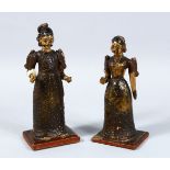 TWO INDIAN KASHMIRI CARVED WOOD & LACQUER FIGURES, both mounted upon wooden bases, decorated with