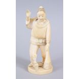 A JAPANESE MEIJI PERIOD CARVED IVORY OKIMONO OF A FISHERMAN, the man stood holding his net, with one