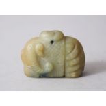 AN EARLY 20TH CENTURY CHINESE CARVED JADE PENDANT OF AN ELEPHANT, bearing yin yang mark 3cm high x