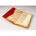 AN EARLY NORTH AFRICAN BOOK OF PRAYER, dated 113, Hijra, in later red leather binding, 18cm x 12cm.