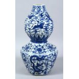 A GOOD CHINESE MING STYLE BLUE & WHITE PORCELAIN DOUBLE GOURD VASE, with panel decoration of