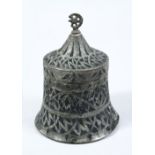 AN EARLY ISLAMIC METAL DISH & COVER IN THE SHAPE OF A BELL, with chased decoration, 16cm high.