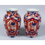 A GOOD PAIR OF 19TH CENTURY JAPANESE IMARI VASES, both vases decorated in typical imari palate