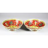 TWO 19TH / 20TH CENTURY CHINESE FAMILLE VERTE DRAGON BOWLS, the interior of the bowls decorated with