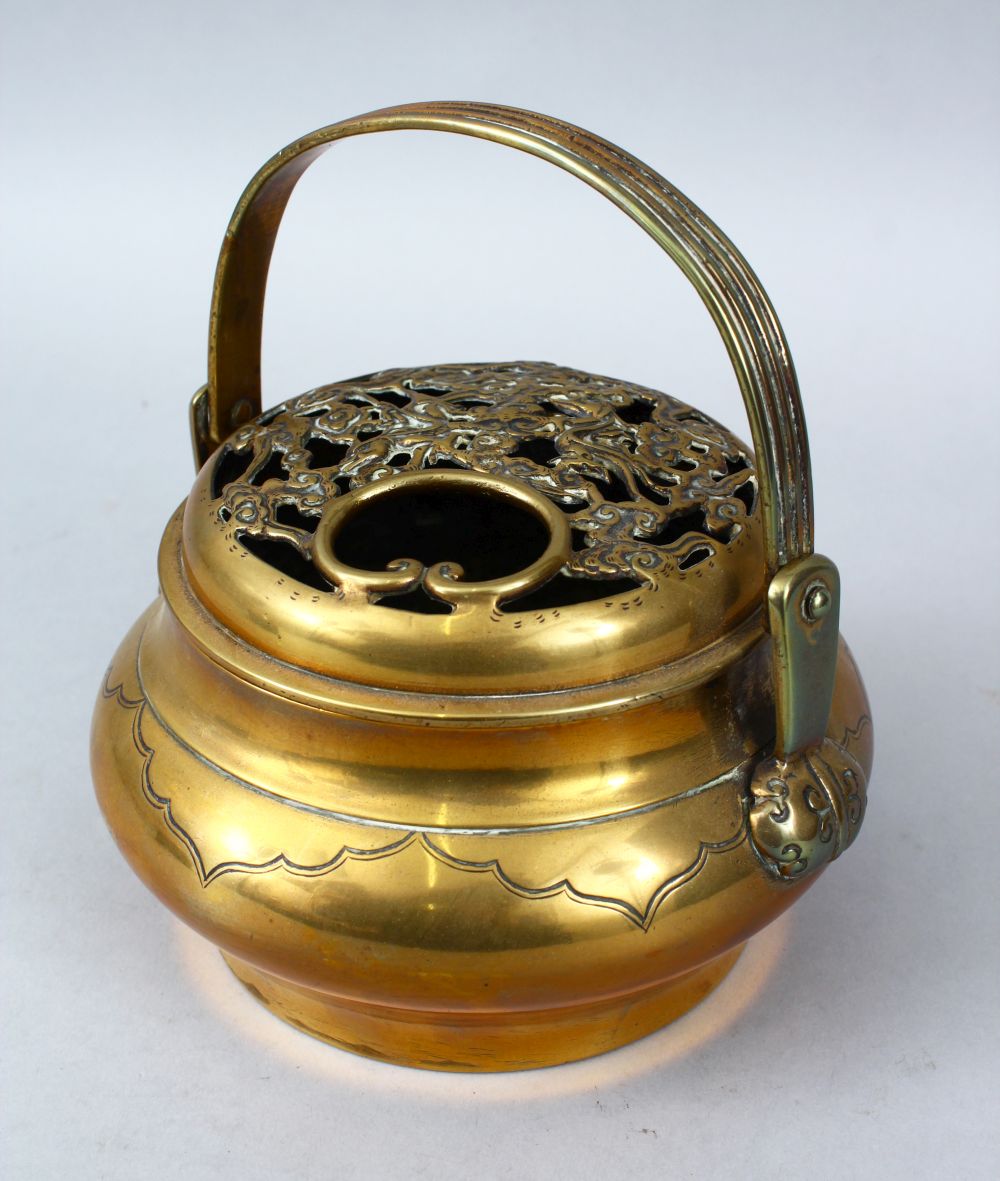 A 19TH / 20TH CENTURY CHINESE BRONZE CENSER, With a carved and pierced lid with ruyi and floral