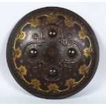 A GOOD PERSIAN CIRCULAR STEEL SHIELD, with gilded decoration and pierced brass onlaid design, 36cm