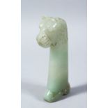 A 19TH CENTURY INDIAN MUGAL CARVED JADE DAGGER HANDLE OF A LION / BEAST, 12cm high x 7cm wide.