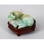 A 19TH / 20TH CENTURY CHINESE CARVED JADEITE FIGURE OF A BULL, the bull in a recumbent position,