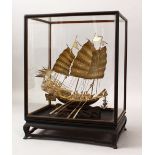 A 19TH CENTURY CHINESE SOLID SILVER CASED MODEL OF A JUNK / SHIP, the junk housed within a