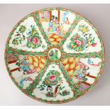 A LARGE 19TH CENTURY CHINESE CANTON FAMILLE ROSE PORCELAIN CHARGER, with panel decoration