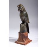 A CARVED HORN MODEL OF A PARROT, on a hardwood stand, 18cm high overall.