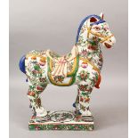 A LARGE 19TH / 20TH CENTURY CHINESE CANTON FAMILLE ROSE PORCELAIN MODEL OF A HORSE, decorated with