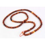 A SET OF CHINESE HORN ROSARY BEADS, consisting of 109 round beads, each approximately measuring 1.