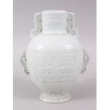 A LOVELY CHINESE QIANLONG STYLE JINGDEZHEN WHITE MONOCHROME PORCELAIN TWIN HANDLE VASE, the body