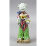 A 19TH CENTURY CHINESE FAMILLE ROSE PORCELAIN FIGURE, of a boy / actor holding a ruyi scepter, 19.