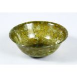 A SMALL 19TH / 20TH CENTURY CHINESE JADEITE CUP, 8cm diameter.