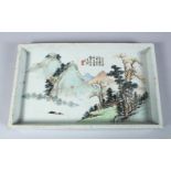 A GOOD CHINESE 19TH CENTURY FAMILLE ROSE PORCELAIN TEA TRAY, the tray decorated with a native