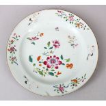 AN 18TH CENTURY CHINESE FAMILLE ROSE PORCELAIN PLATE, decorated with scenes of native flora and