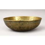 A GOOD QAJAR BRONZE CIRCULAR BOWL, engraved with figures and calligraphy, 20cm diameter.